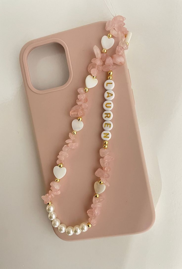 oréva beaded phone charm held in hand