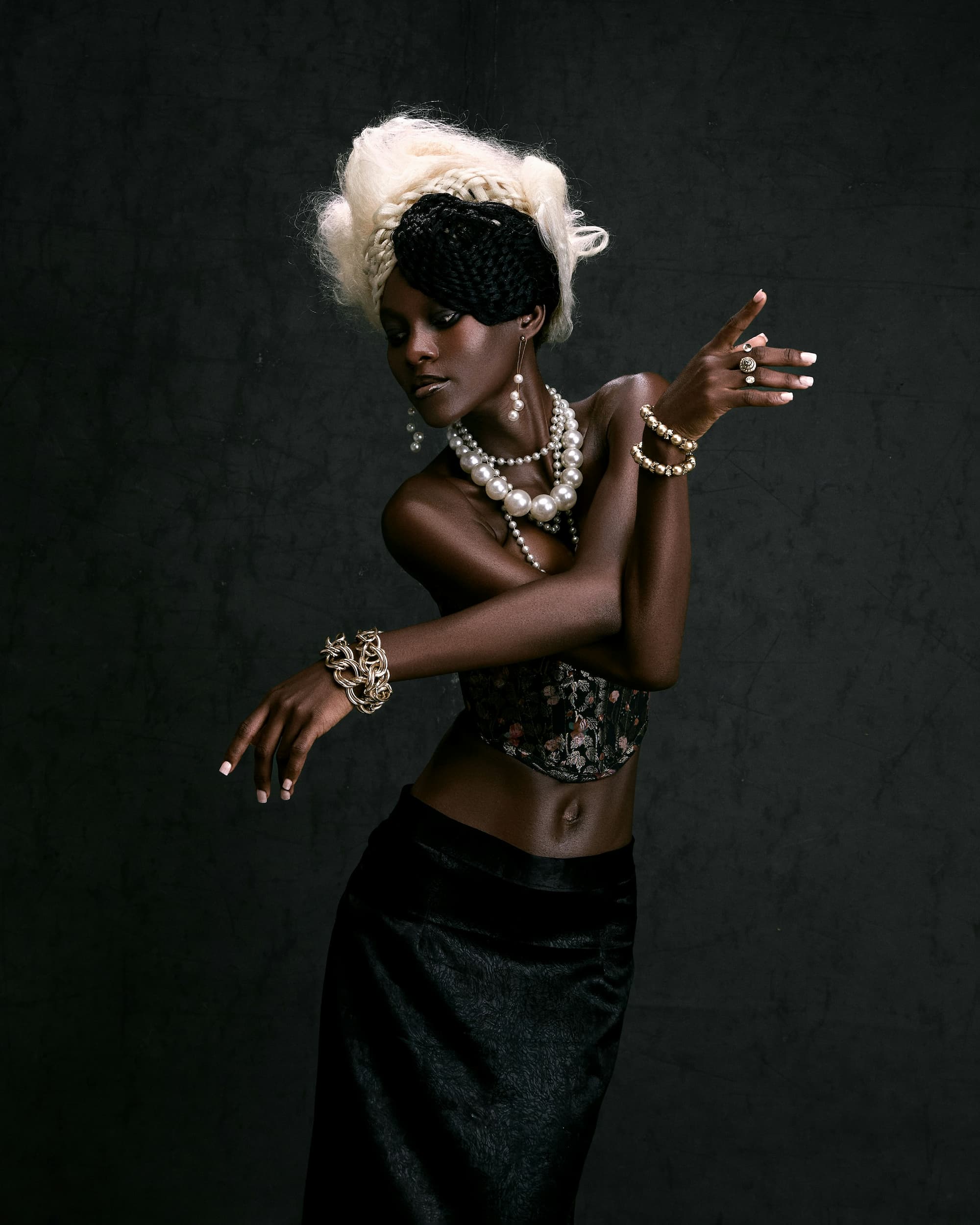 oréva campaign shot, the coral stack bracelet worn
