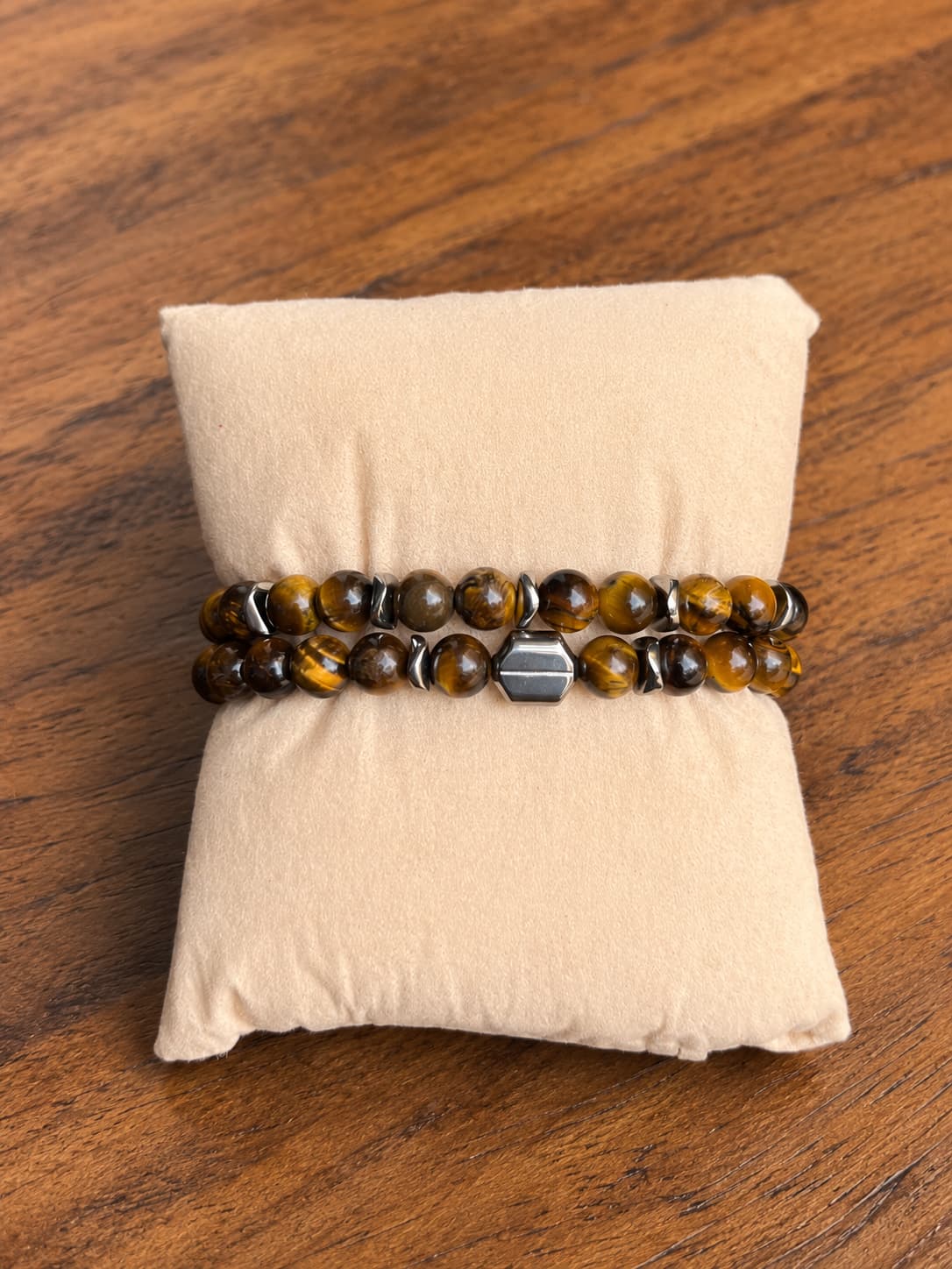 oréva Tempest stacked coral and brass bracelets, close crop