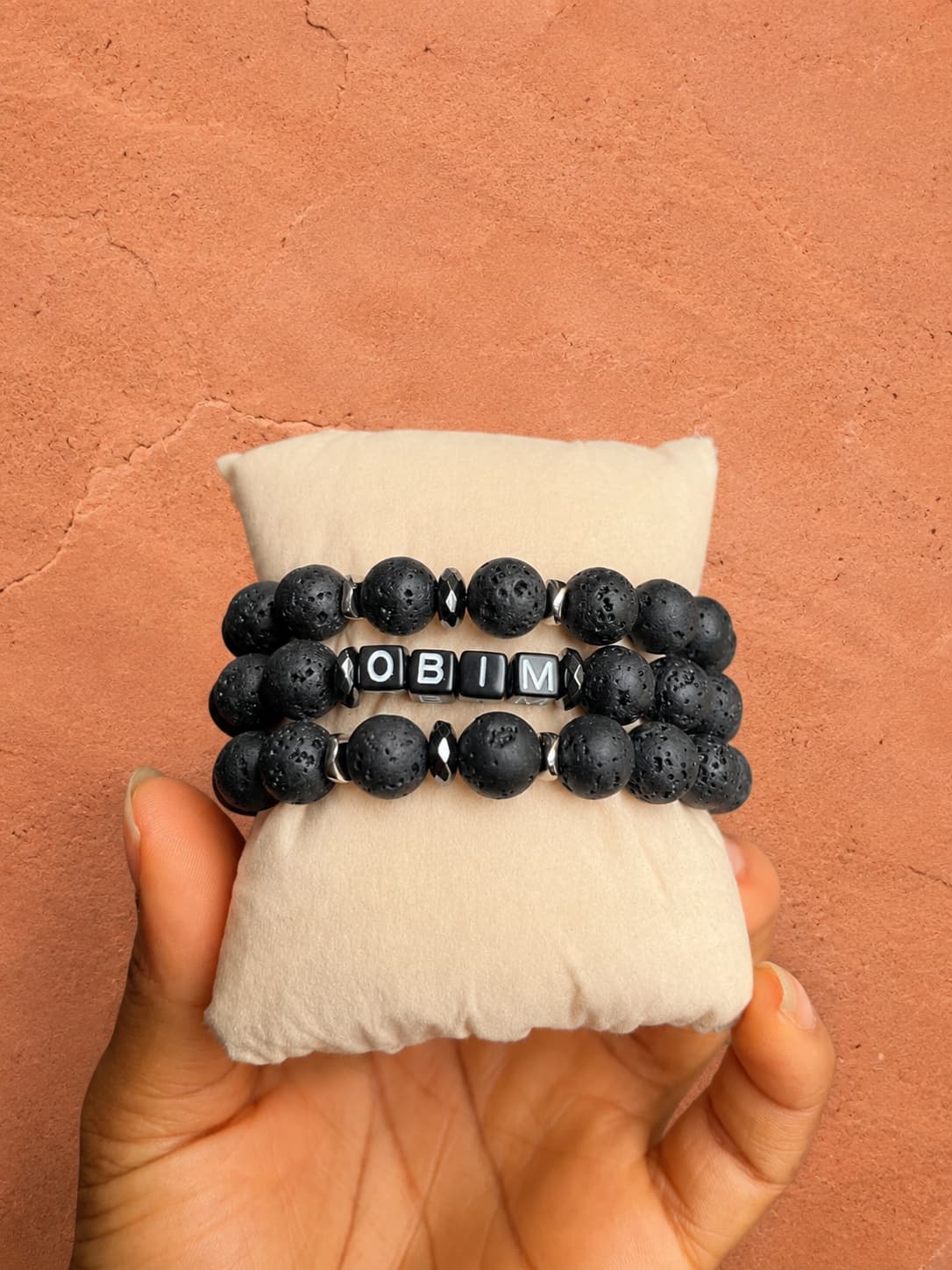oréva The Regiment cowrie and black glass bracelet on dark skin